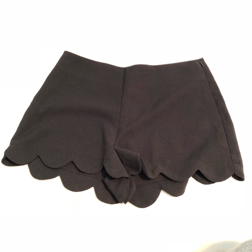 Black soft shorts with scallop bottom.